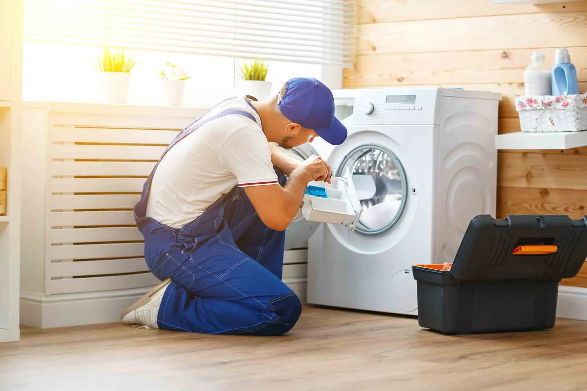 Service technician repairing a washing machine